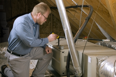 technician inspecting home furnace