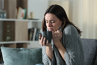 woman cold in her home