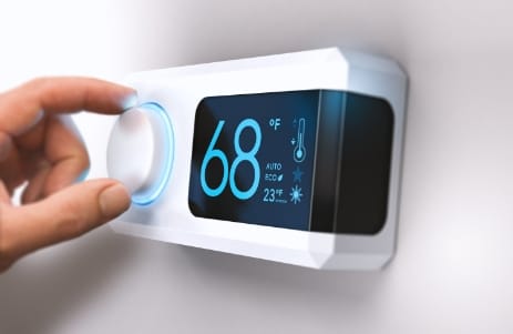 Man changing thermostat