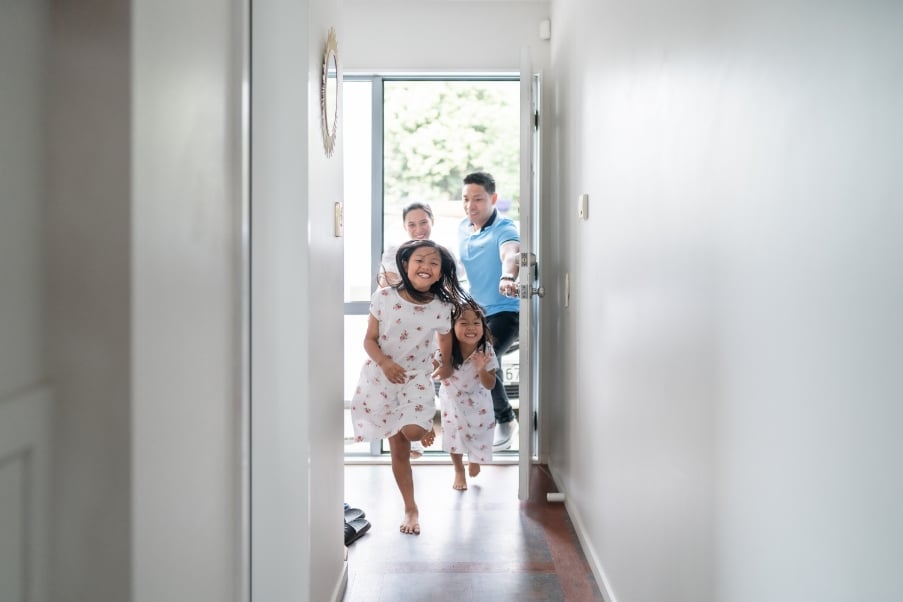Family running into home